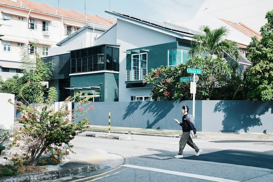 Landed homes along a quiet residential street in Upper Bukit Timah, District 21